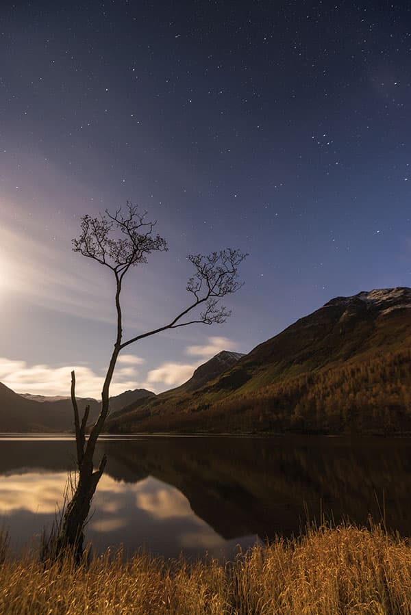 Moonlight and stars light up the Buttermere valley in the lake district